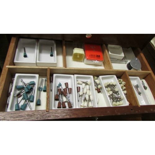 1547 - A 1960's dentist's cabinet containing dentist's equipment.