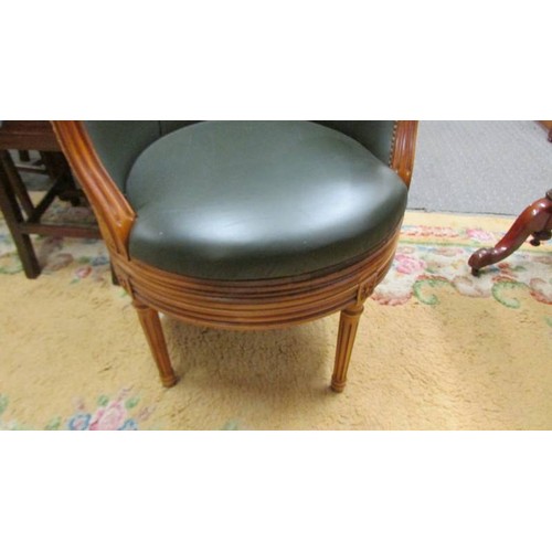 1550 - A superb quality leather upholstered revolving bergere chair.