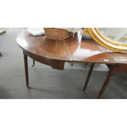 1554 - A D end dining table comprising centre drop leaf table and two D ends.