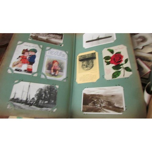 1557 - A box of postcards, photographs and ephemera.