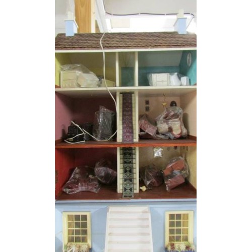 1560 - A Victorian style doll's house with furniture.