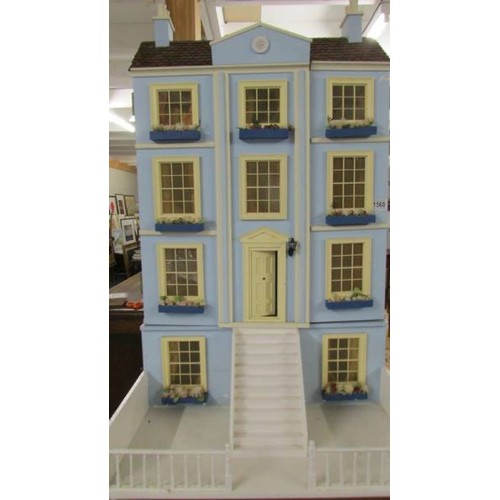 1560 - A Victorian style doll's house with furniture.