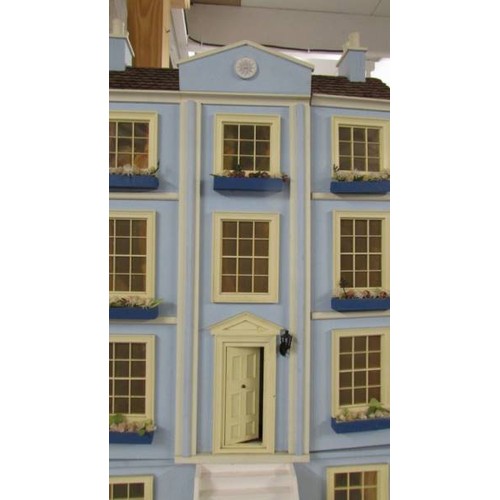 1560 - A Victorian style doll's house with furniture.