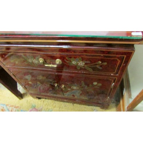 1563 - A lacquered two door one drawer cupboard.