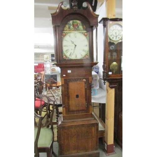 1569 - An oak cased Grandfather clock.