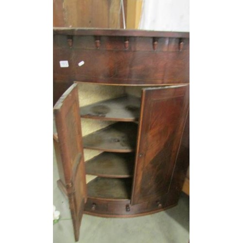 1572 - A Victorian bow front corner cupboard.