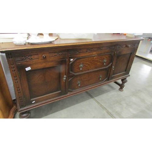 1578 - A large old oak sideboard.