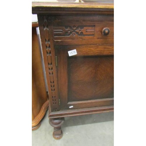 1578 - A large old oak sideboard.