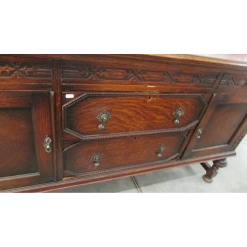 1578 - A large old oak sideboard.