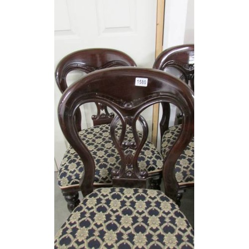 1580 - A set of four mahogany dining chairs.