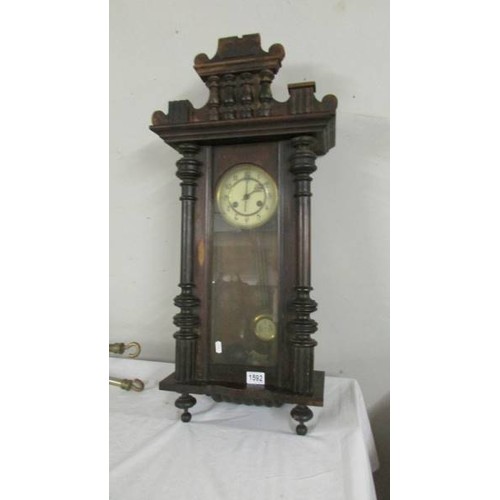 1592 - A mahogany wall clock.