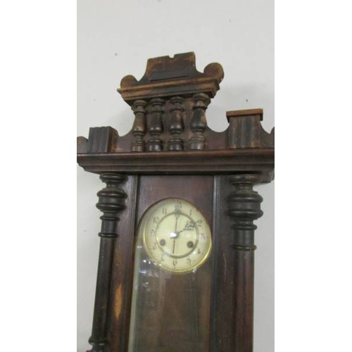 1592 - A mahogany wall clock.