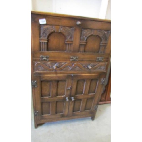 1594 - An oak drinks cabinet.