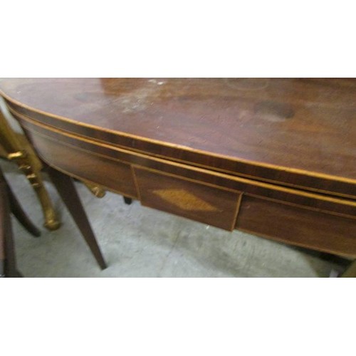 1604 - A mahogany fold over card table.