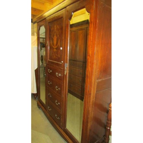 1621 - An Edwardian mahogany inlaid combination wardrobe.