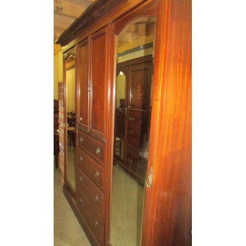 1622 - An Edwardian inlaid bedroom suite comprising combination wardrobe, dressing table, wash stand and be... 