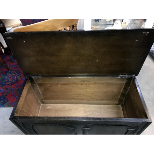 357 - An oak blanket box with carved front 95cm x 42cm x Height 54cm * Collect Only*