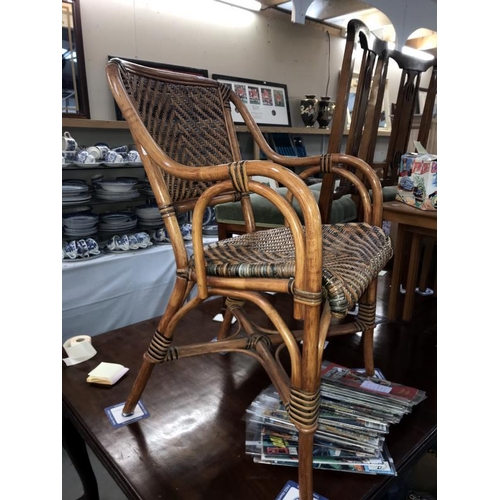 389 - A bamboo and wicker carver chair