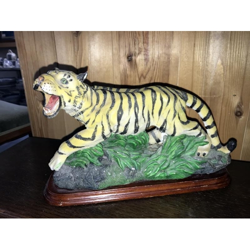 395 - A bronze effect resin tiger figurine, a bronze effect planter golden eagle, etc