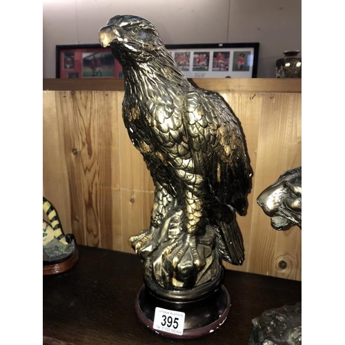 395 - A bronze effect resin tiger figurine, a bronze effect planter golden eagle, etc