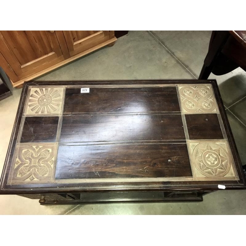 428 - A dark wood stained coffee table with 4 drawers & 2 shelves - 92cm x 51cm x 50cm high