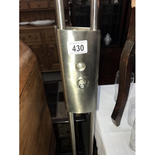 430 - A brushed stainless uplighter/floor standing standard lamp