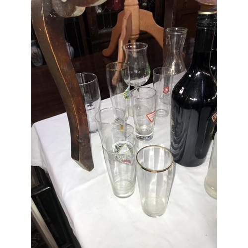 432 - A quantity of bottle of drink including Harveys, Baileys & Sheridan's etc. & a quantity of glasses s... 