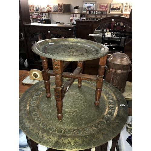 436 - A large Indian brass topped folding table & 1 other