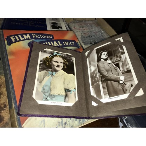 1628 - An album of film star postcards & early Disney postcards & film related books including 1930's