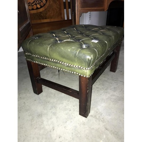 1631 - A deep buttoned green leather foot stool