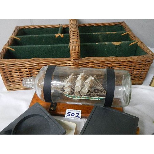 502 - A mixed lot including ship in bottle, trinket boxes etc.,