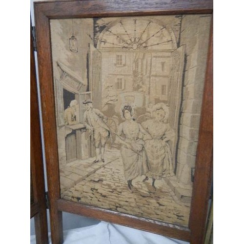 511 - A two fold circa 1920's tapestry fire screen.