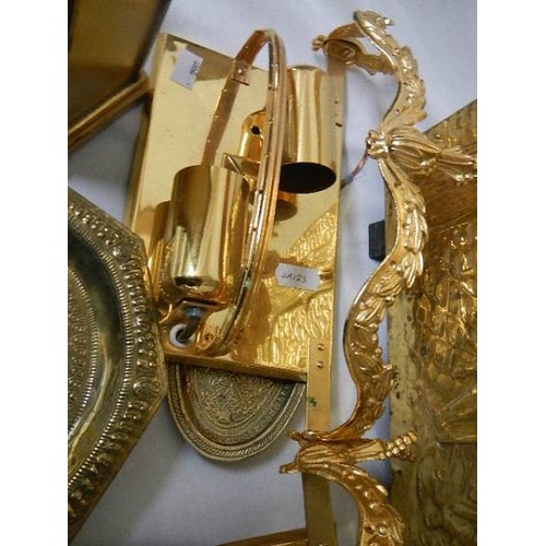 512 - A brass magazine rack and other brass ware.