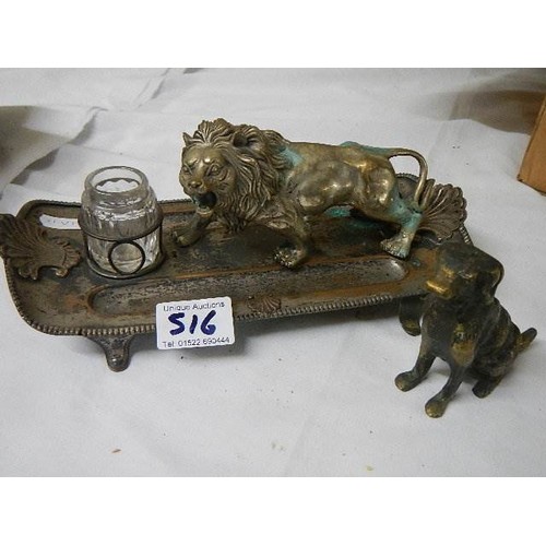 516 - An antique inkstand mounted with a lion and a brass dog,.