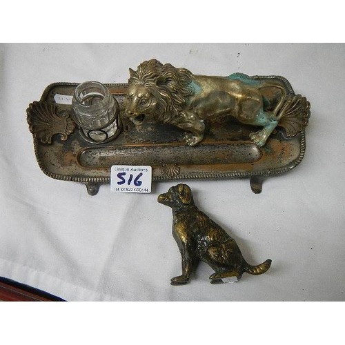 516 - An antique inkstand mounted with a lion and a brass dog,.