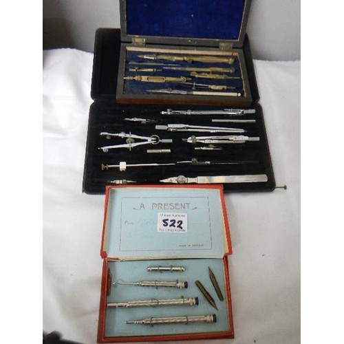 522 - Two part geometry sets and a pen set.