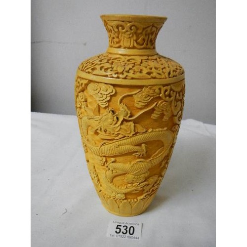 530 - A Chinese style vase with dragons.