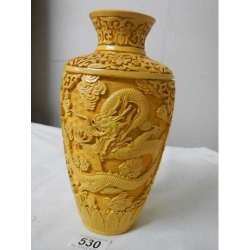 530 - A Chinese style vase with dragons.