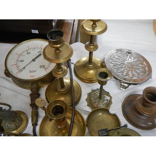 550 - A mixed lot of brass ware including candlesticks, pressure gauge etc.,