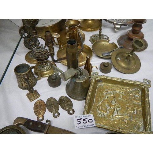 550 - A mixed lot of brass ware including candlesticks, pressure gauge etc.,