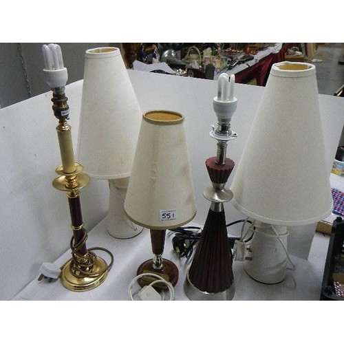 550 - A mixed lot of brass ware including candlesticks, pressure gauge etc.,