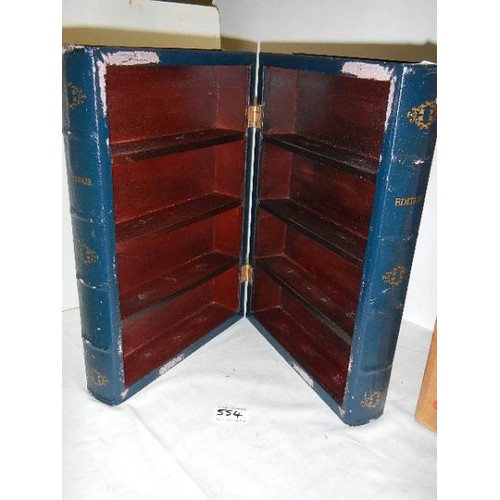 554 - A book shaped storage box with shelves.