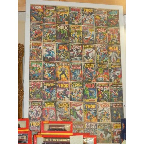 557 - A framed and glazed print of Marvel comics.
Collect only