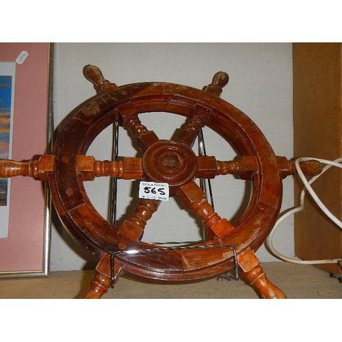 565 - A small wooden ship's wheel.