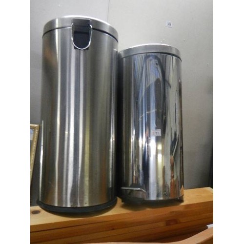 571 - Two stainless steel waste bins.