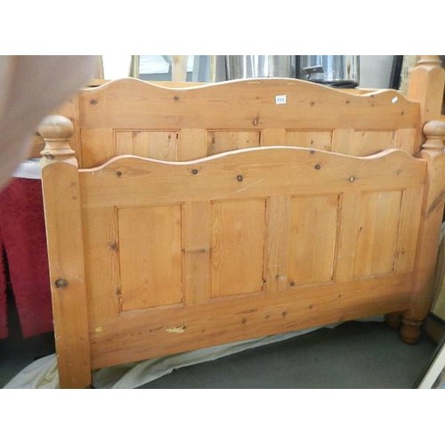 572 - A pine double bed frame.