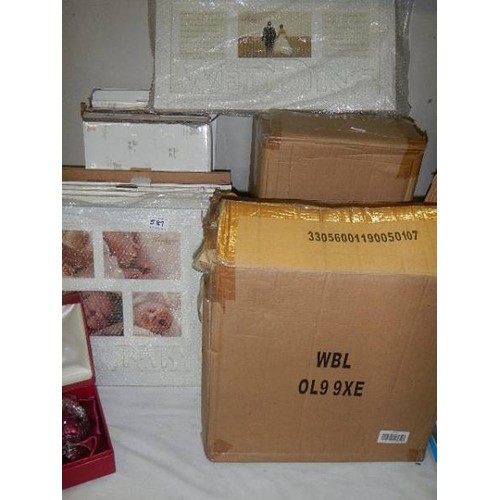 581 - A quantity of new baby and wedding related photo frames.