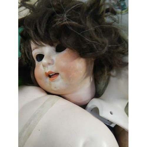 595 - A quantity of doll parts including German porcelain head.