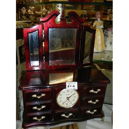 604 - A jewellery box with clock containing an assortment of costume jewellery.