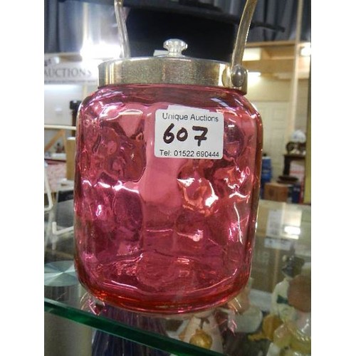 607 - A cranberry glass biscuit barrel.